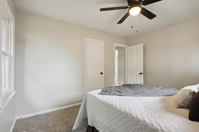 bedroom with ceiling fan and carpet floors