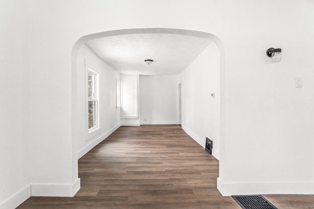 hall with dark hardwood / wood-style flooring