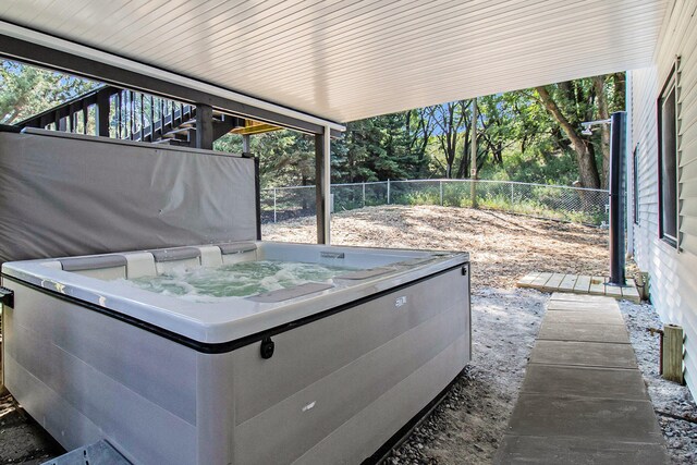 view of patio / terrace featuring a hot tub