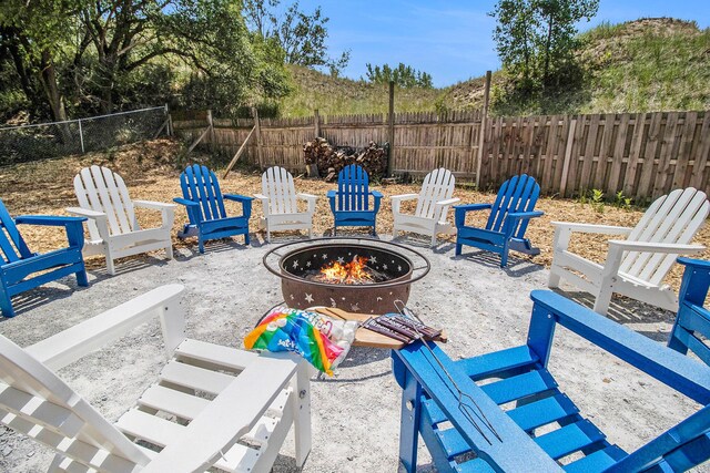 view of patio with a fire pit