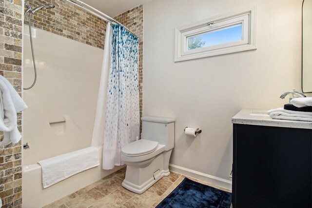 full bathroom with vanity, shower / bathtub combination with curtain, and toilet