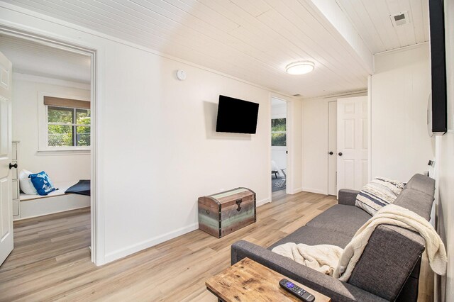 living room with wooden ceiling and light hardwood / wood-style flooring