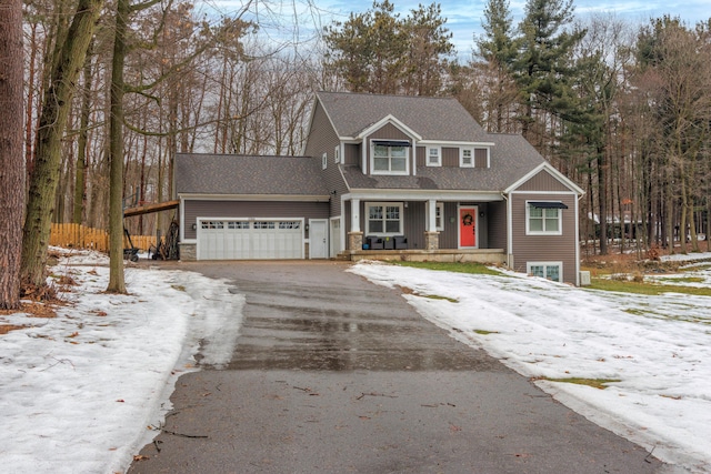 view of front of home with a porch and a garage