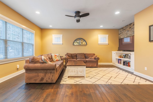 living room featuring ceiling fan and light hardwood / wood-style flooring