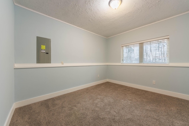 unfurnished room featuring electric panel, crown molding, carpet flooring, and a textured ceiling