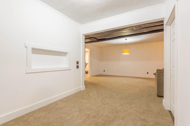 empty room with carpet floors and a textured ceiling