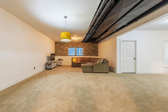 living area with carpet flooring and brick wall