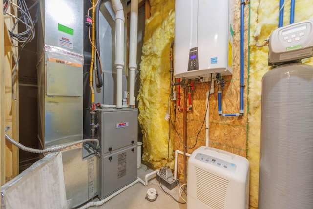 utility room with heating unit and tankless water heater