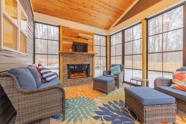 sunroom with a fireplace, vaulted ceiling, and wooden ceiling