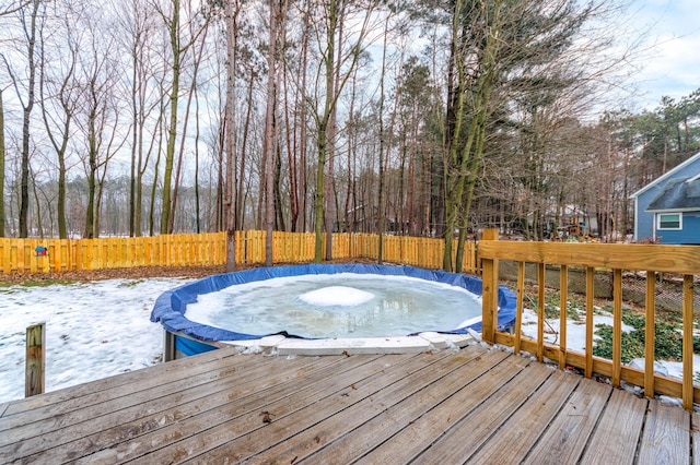 view of snow covered deck