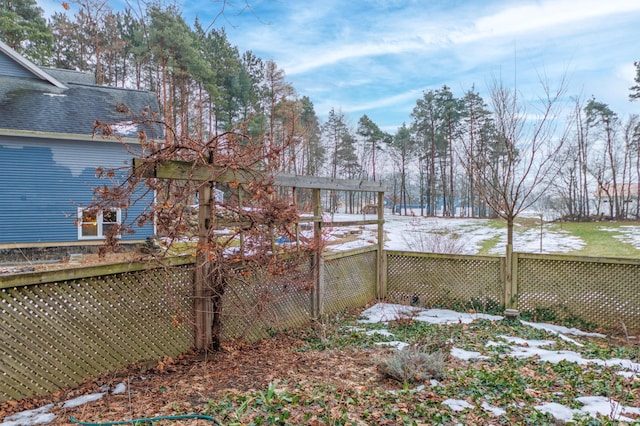 view of yard layered in snow