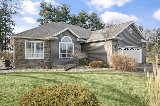 ranch-style house featuring a garage, a front lawn, and central air condition unit