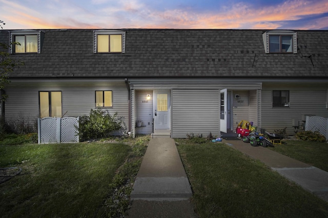 view of front of home featuring a yard