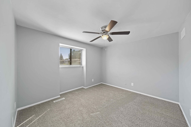 empty room with ceiling fan and carpet flooring