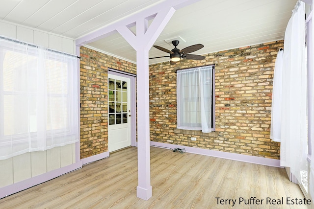 unfurnished sunroom with beamed ceiling and ceiling fan