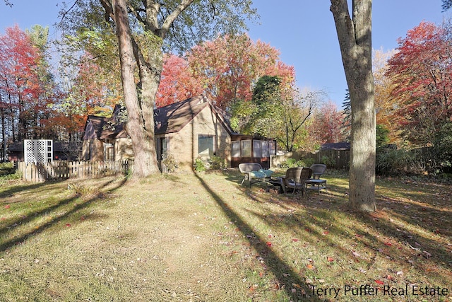 view of yard with a sunroom