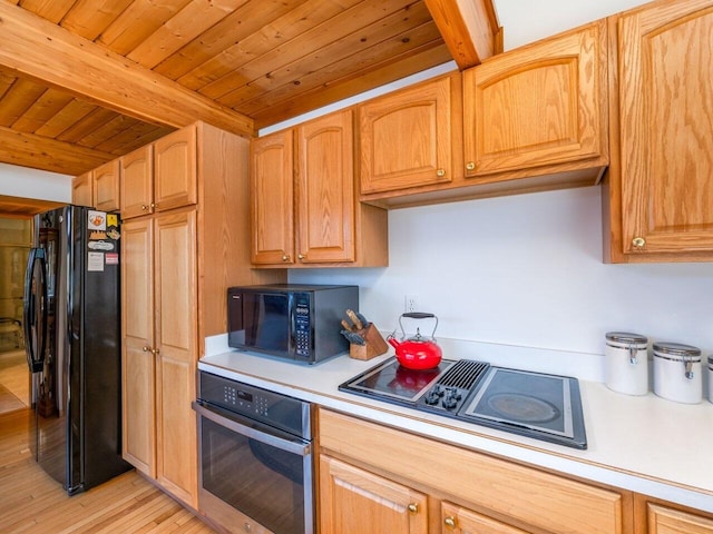 kitchen featuring beam ceiling, black appliances, wooden ceiling, and light wood-type flooring