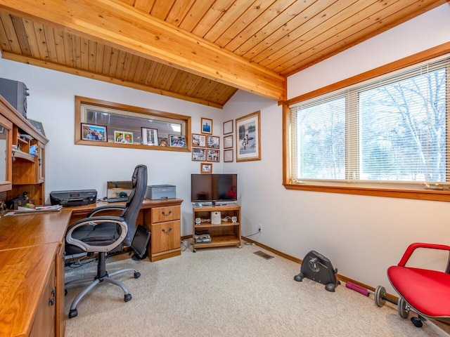 office space with beam ceiling, wooden ceiling, a healthy amount of sunlight, and carpet flooring