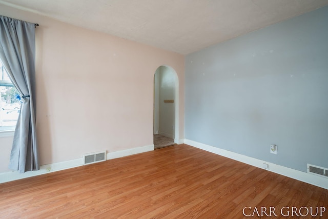 unfurnished room with light hardwood / wood-style flooring