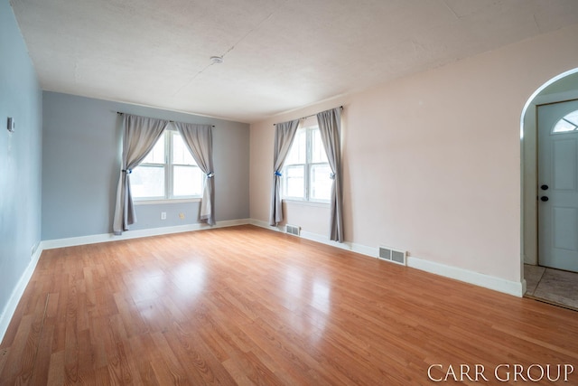 spare room featuring light wood-type flooring