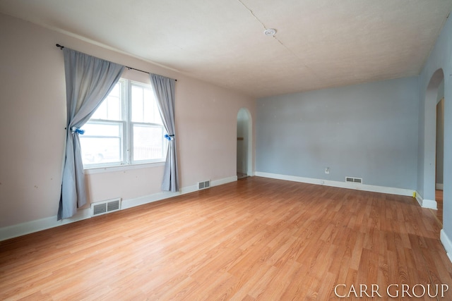 empty room featuring hardwood / wood-style floors