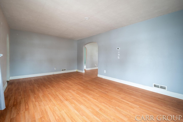 empty room with light hardwood / wood-style floors