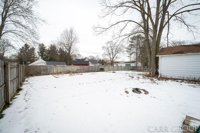 view of yard layered in snow