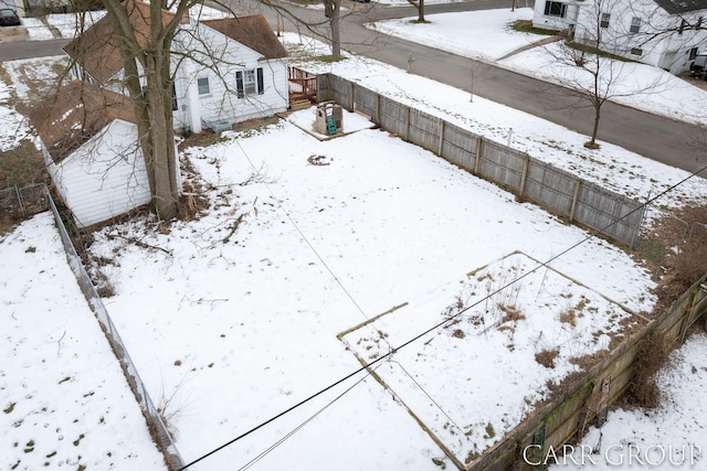 view of yard layered in snow