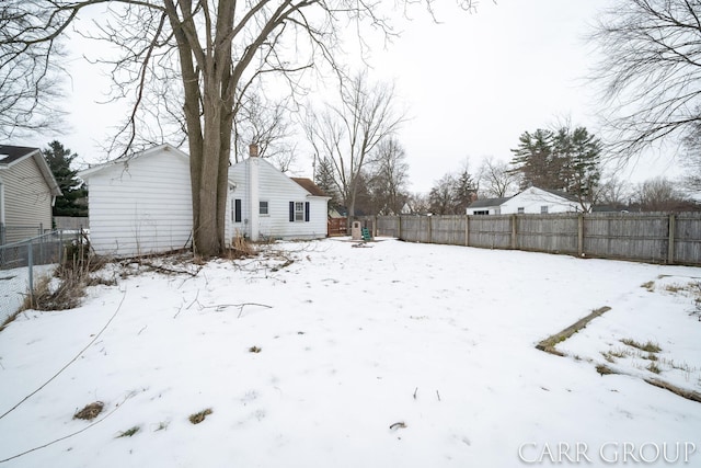 view of yard layered in snow