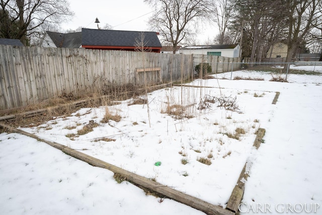 view of yard covered in snow