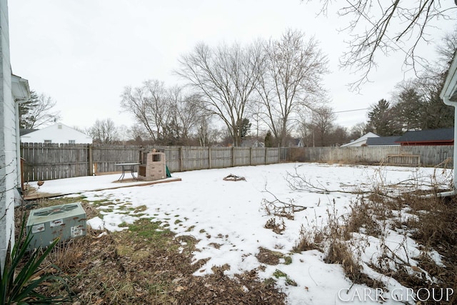 yard covered in snow featuring central air condition unit