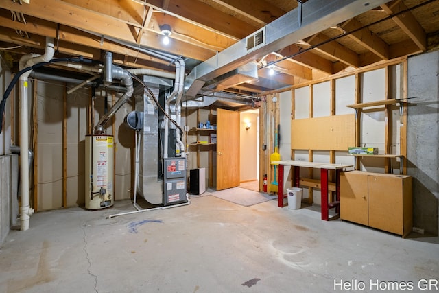 basement featuring heating unit and water heater