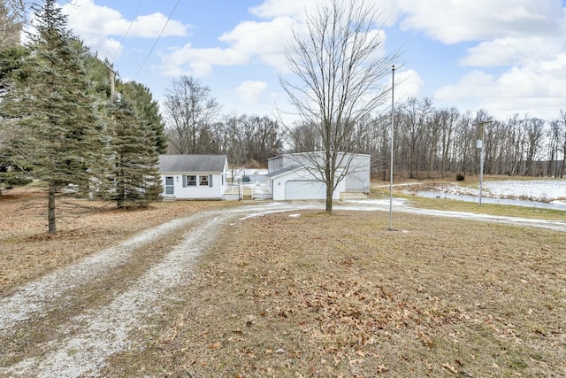 view of front of property featuring an outdoor structure