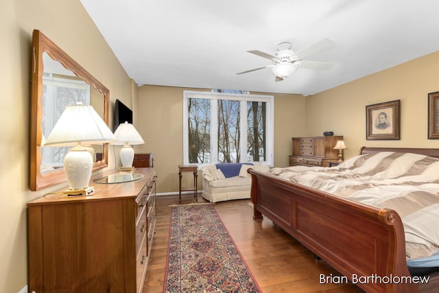 bedroom with hardwood / wood-style flooring and ceiling fan