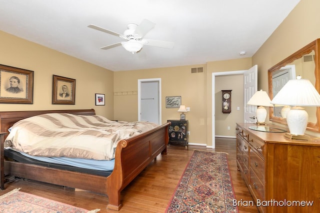 bedroom featuring ceiling fan and wood-type flooring