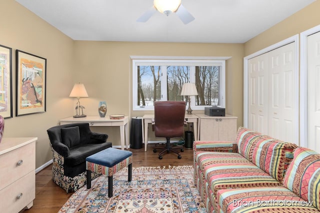 office space with ceiling fan and light hardwood / wood-style flooring