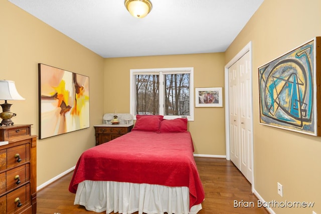 bedroom featuring hardwood / wood-style flooring and a closet