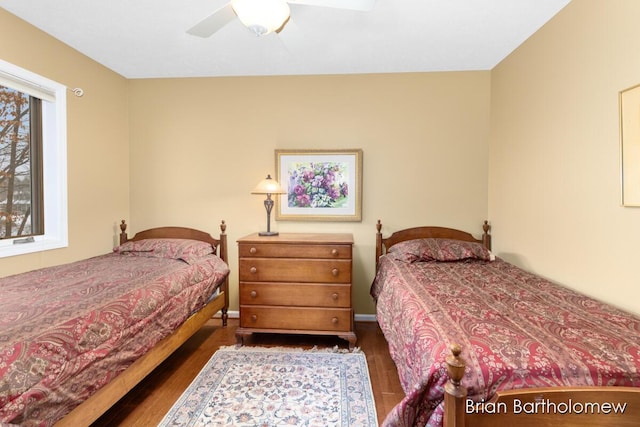 bedroom featuring dark wood-type flooring and ceiling fan