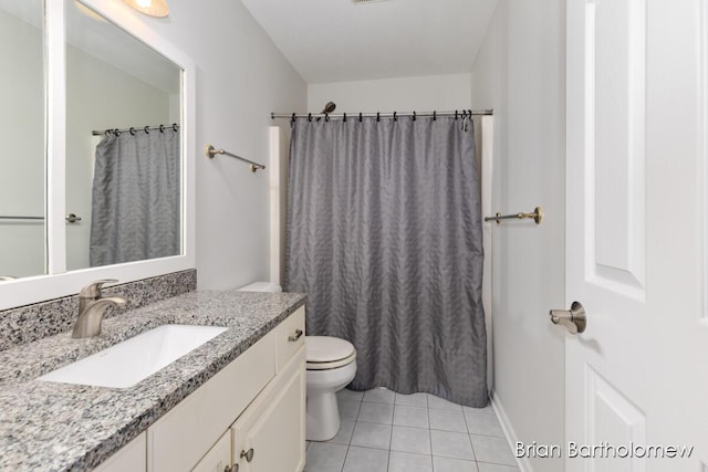 bathroom with vanity, curtained shower, tile patterned floors, and toilet