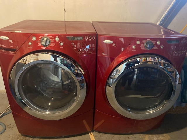 washroom with laundry area and washer and dryer