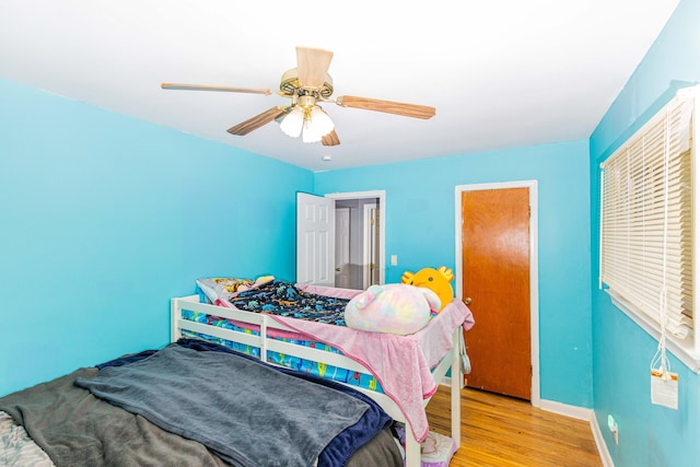 bedroom featuring ceiling fan and light hardwood / wood-style floors