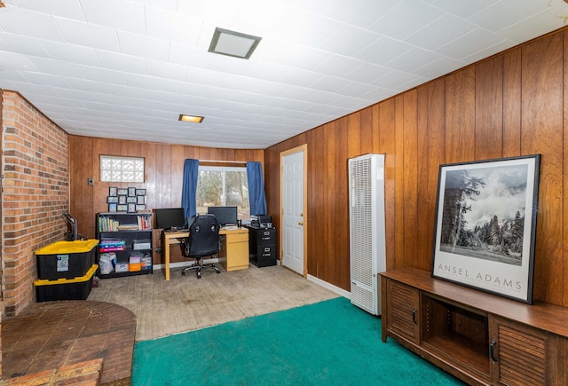 office with wooden walls and dark colored carpet