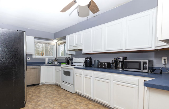 kitchen featuring ceiling fan, appliances with stainless steel finishes, and white cabinets