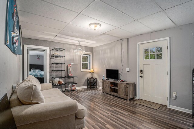 2678 Richmond St NW, Grand Rapids, MI 49504 - living room featuring baseboards, a drop ceiling, and wood finished floors