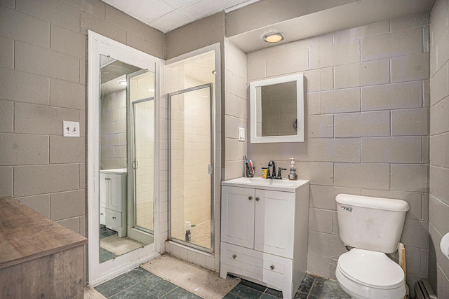 2678 Richmond St NW, Grand Rapids, MI 49504 - full bath featuring vanity, concrete block wall, a stall shower, and toilet