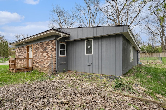 2678 Richmond St NW, Grand Rapids, MI 49504 - view of home's exterior featuring fence and brick siding