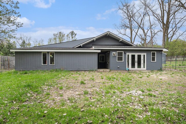 2678 Richmond St NW, Grand Rapids, MI 49504 - rear view of house featuring french doors and fence