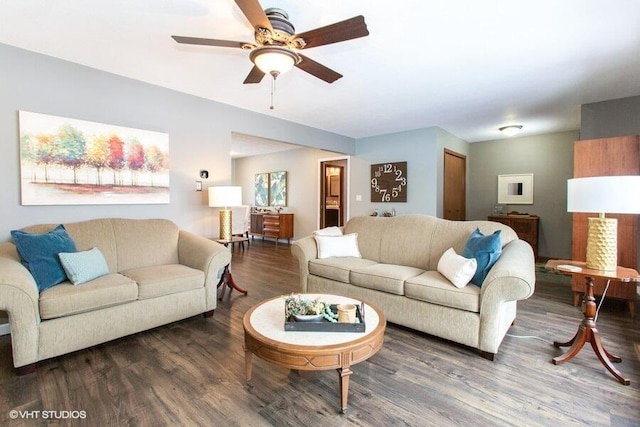 living room with dark wood-style floors and ceiling fan