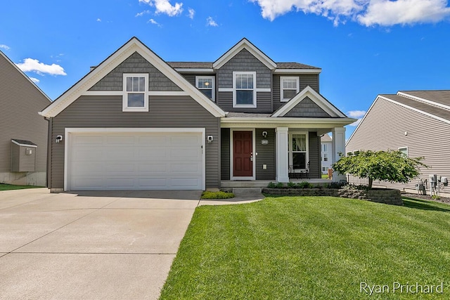 craftsman inspired home with a garage and a front yard