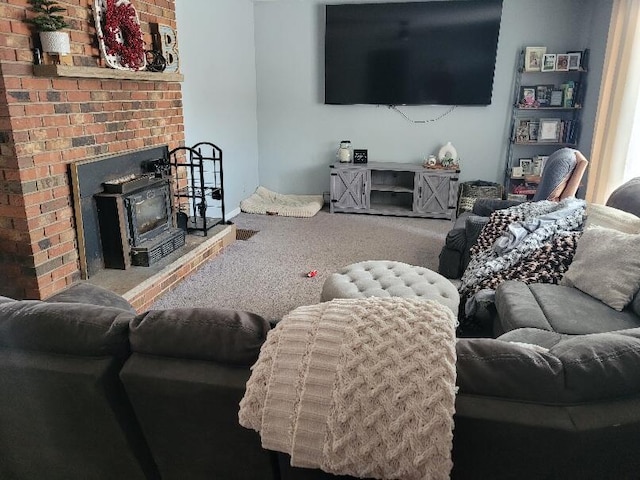 living room with a wood stove and carpet flooring